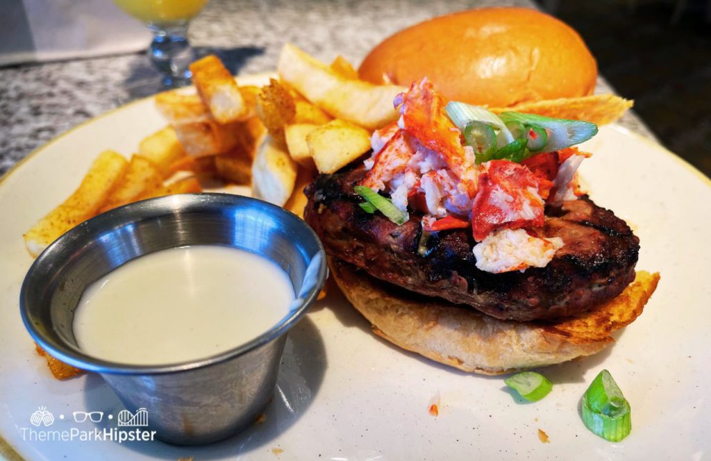 Disney's Grand Floridian Cafe Restaurant Mimosa and Lobster Burger. Keep reading to learn more about the Disney Dining Plan at Walt Disney World Resort.