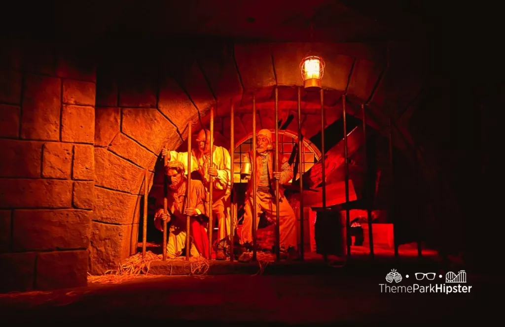 Disney's Magic Kingdom Theme Park jail scene with dog holding the key on the Park Pirates of the Caribbean ride. One of the best rides at the Magic Kingdom.