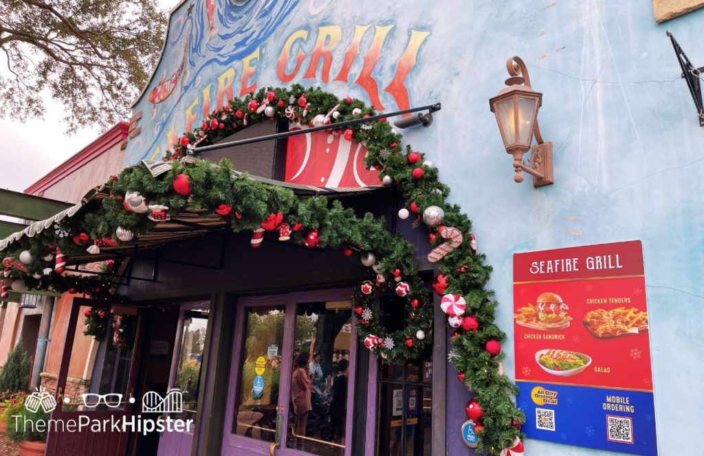 Food Menu at Seafire Grill chicken sandwich all day dining deal and mobile ordering at SeaWorld Orlando Christmas Celebration. Keep reading to learn more about the special events at SeaWorld Orlando.