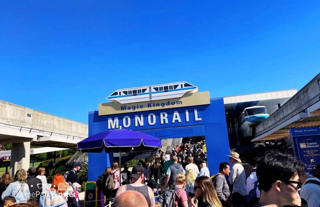 Disney Magic Kingdom Park Monorail transportation on crowded busy day. Keep reading to get the ultimate guide on the best monorail resorts at Disney World.