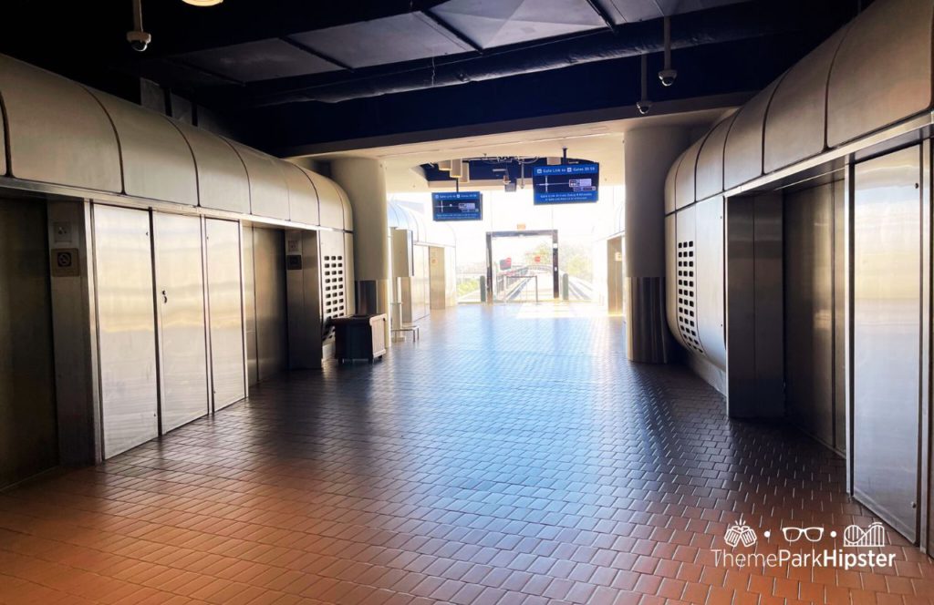 Orlando Airport Tram Stop. Keep reading to learn how to find cheap flights to Disney World.