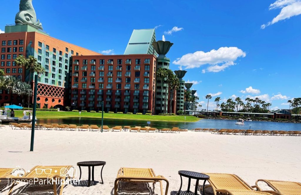Beachside with lounge chairs Swan and Dolphin Resort Hotel at Walt Disney World. Keep reading to find out more about Swan and Dolphin Resort at Walt Disney World.