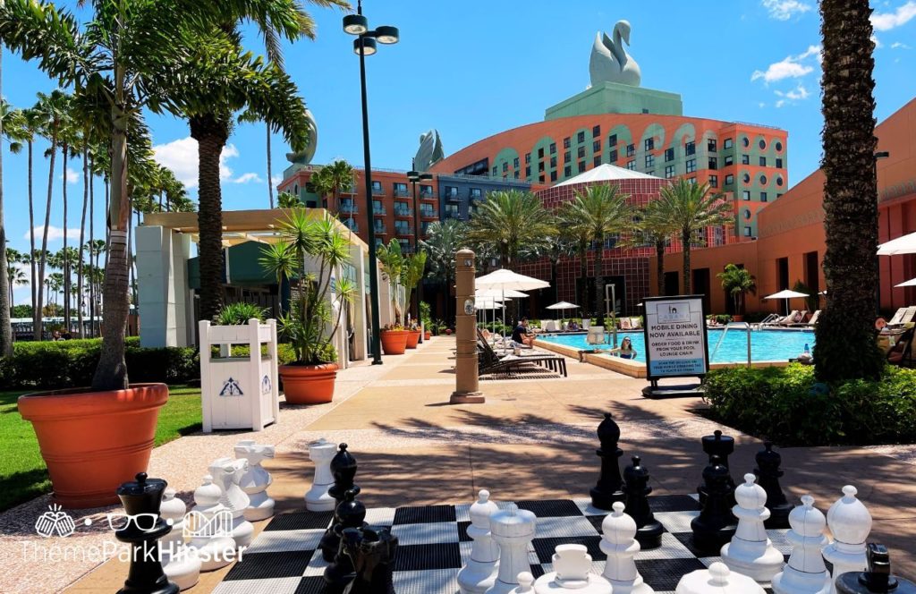 Poolside area with Chess Game Swan and Dolphin Resort Hotel at Walt Disney World. One of the best Disney World Resorts for solo travelers.