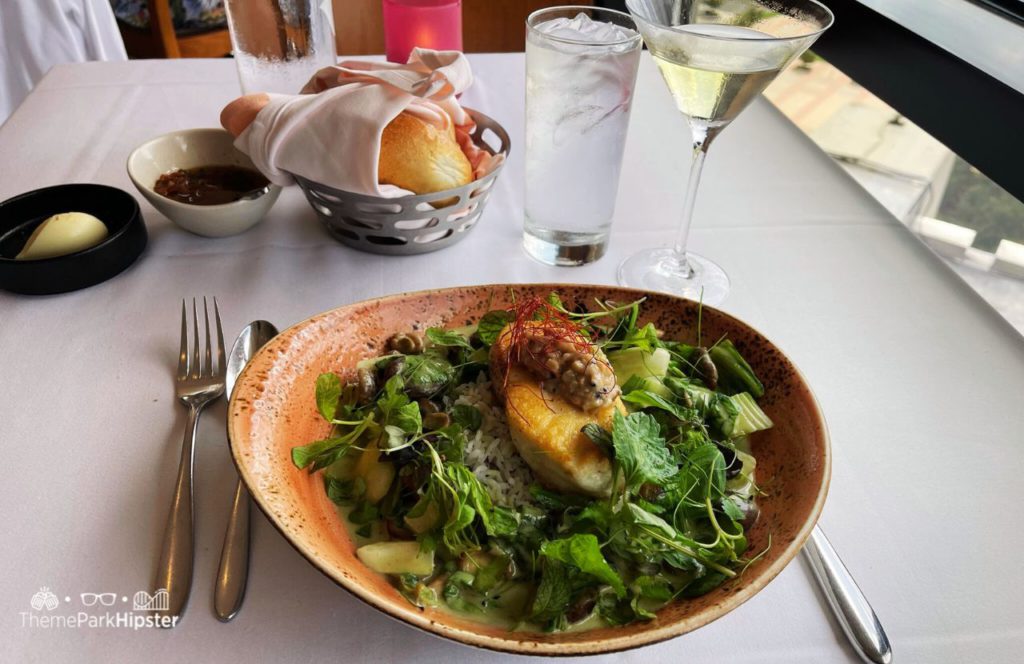 French 75 Martini at Bread and Florida Black Grouper California Grill Restaurant at Disney World's Contemporary Resort. Making it one of the best restaurants at Disney World for adults!