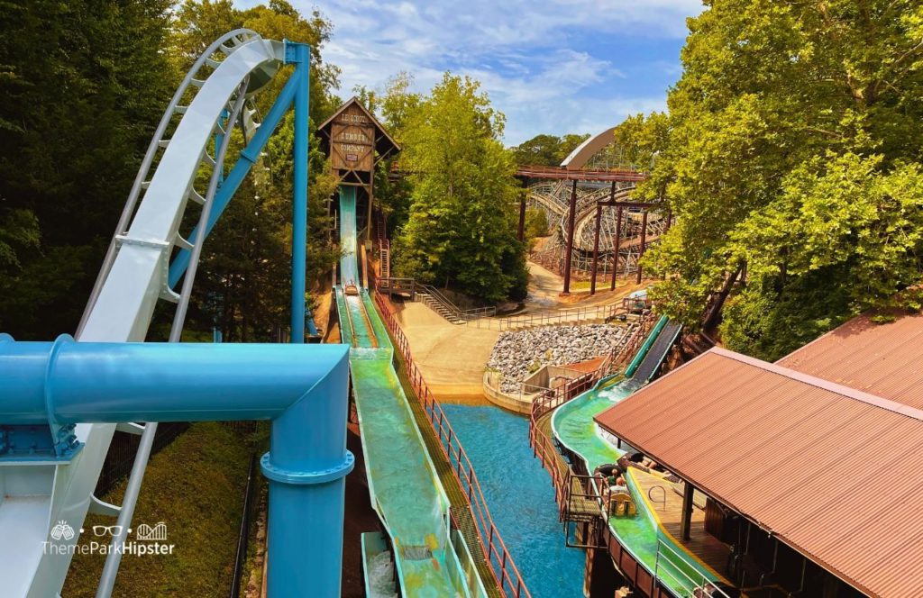 Alpengeist Coaster and Le Scoot Log Flume Water Ride with Invadr in the background at Busch Gardens Williamsburg, Virginia. Keep reading to find out all you need to know about the Elite VIP Tour at Busch Gardens Williamsburg in Virginia.