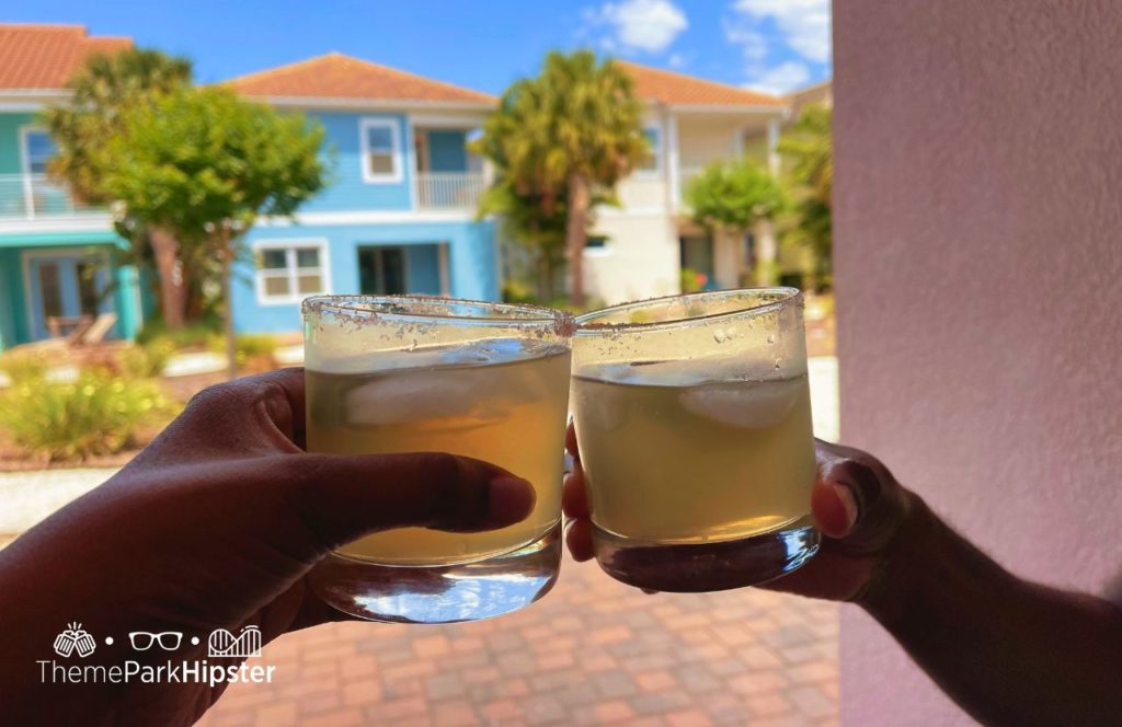 Enjoying a margarita on the balcony at Margaritaville Resort Orlando Hotel. One of the best vacation home rentals near Disney World