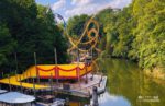 Rhine River Tour with Griffon and Loch Ness Roller Coaster in the background at Busch Gardens Williamsburg, Virginia